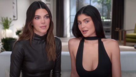 I Can't Figure Out What's Going On With Kendall Jenner In This Beach Video, But Kylie Definitely Knows How To Rock A Red Swimsuit