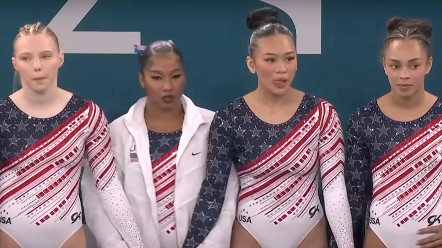 I Can't Stop Watching This Adorable Video Of A Cat 'Saving' An Olympian From A Balance Beam Fall